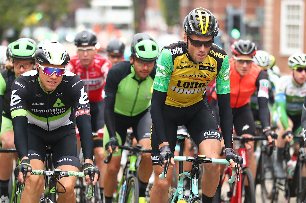 Professional cyclists riding bikes at Tour of Britain